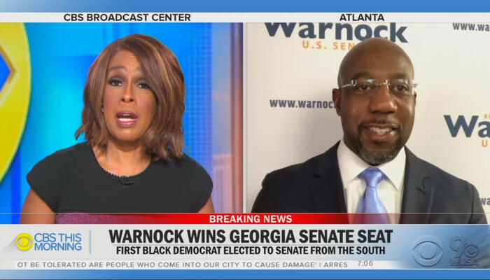 Gayle King and Raphael Warnock