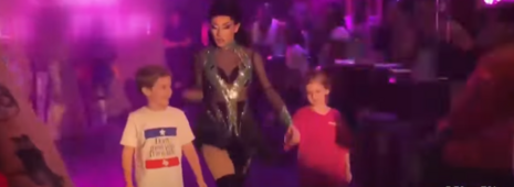 Drag performers bring children onto the stage