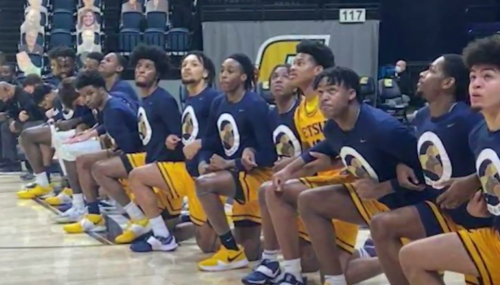 East Tenn. State basketball team kneeling