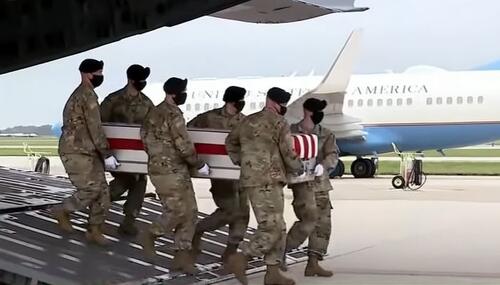 Soldiers carry the casket of an American soldier killed in Kabul