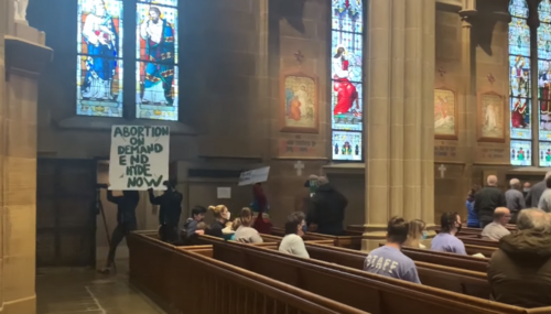 Protestors disrupting Catholic Mass