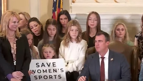 Oklahoma Gov. Kevin Stitts and female athletes Oklahoma Gov. Kevin Stitts and female athletes