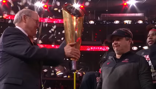 Kirby Smart, right Coach Kirby Smart, right, receives national championship trophy