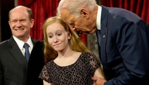 Joe Biden nuzzles daughter of Sen. Chris Coons