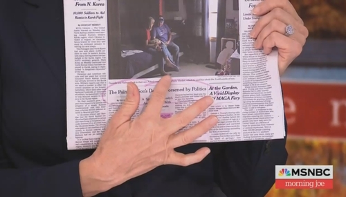 Mika Brzezinski holding front page NYT story on death of Aiden Clark Mika Brzezinski holding front page NYT story on death of Aiden Clark