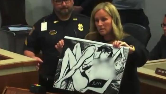 NextImg:Cop Stops Mom From Exposing Sexually Explicit Content At School Board Meeting